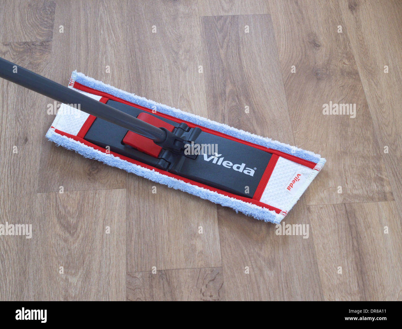 Vileda Mop Mopping a Beech Effect Vinyl Floor Stock Photo Alamy