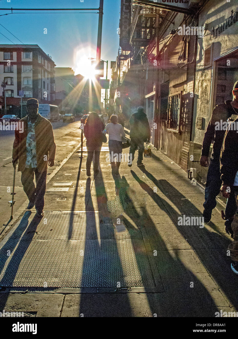 Setting sun shines on the sidewalk in the high crime Tenderloin district in San Francisco. Note