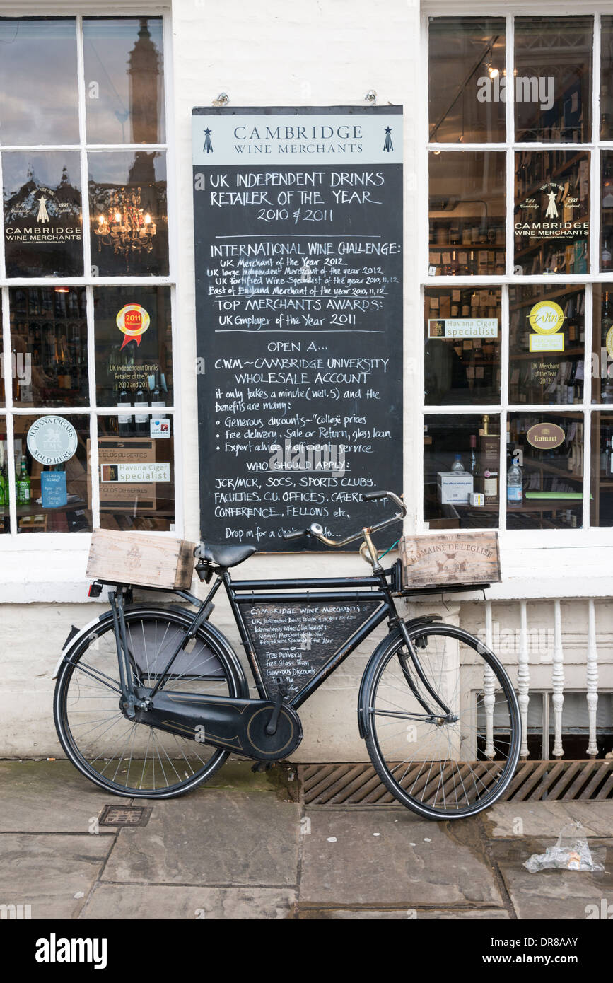 The Cambridge Wine Merchant shop Kings Parade Cambridge UK with traditional cycle parked outside Stock Photo