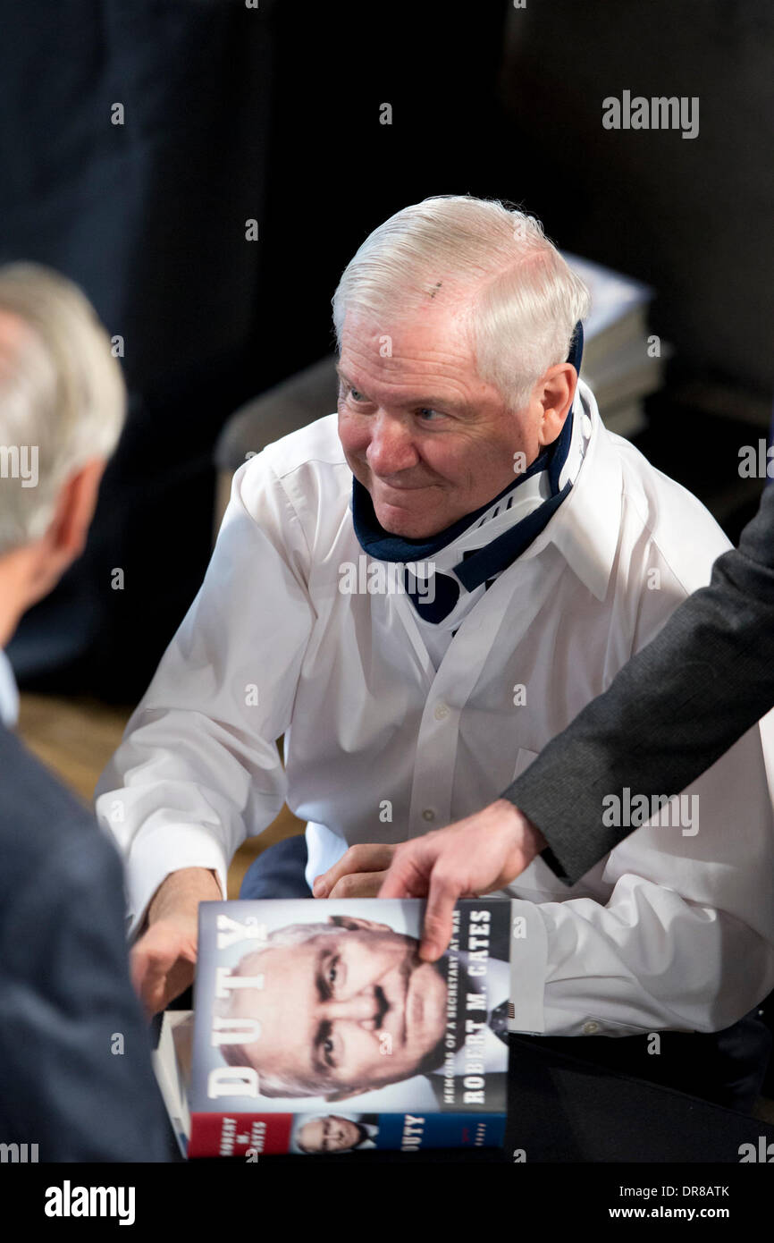Former secretary of defense Robert Gates signs book after talking about 'Duty,' which criticizes Bush and Obama administrations Stock Photo