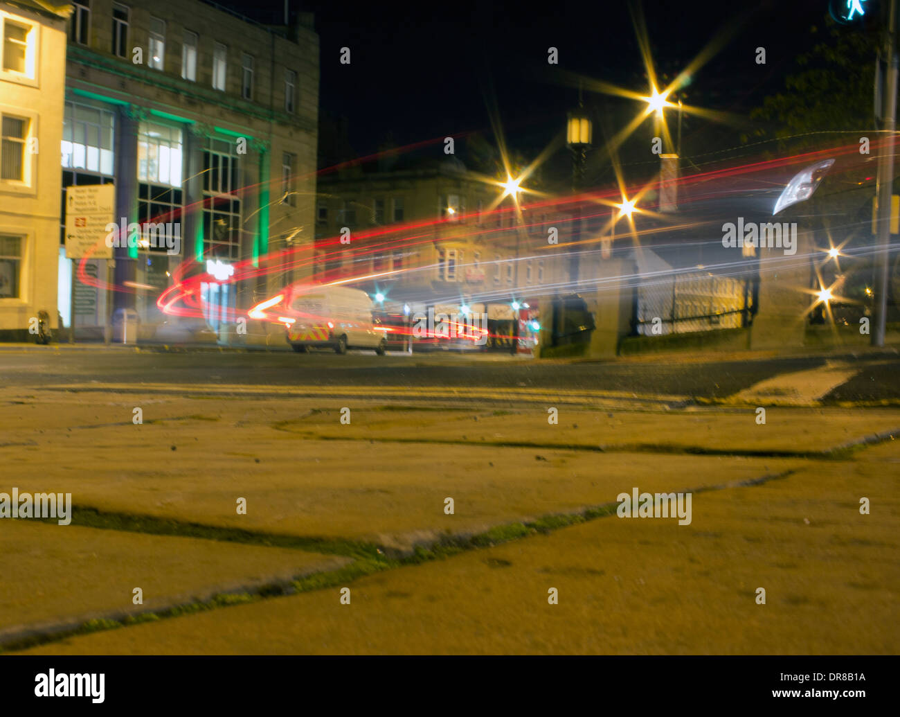 low level 3 second time exposure of traffic trails at night in barnsley town centre Stock Photo