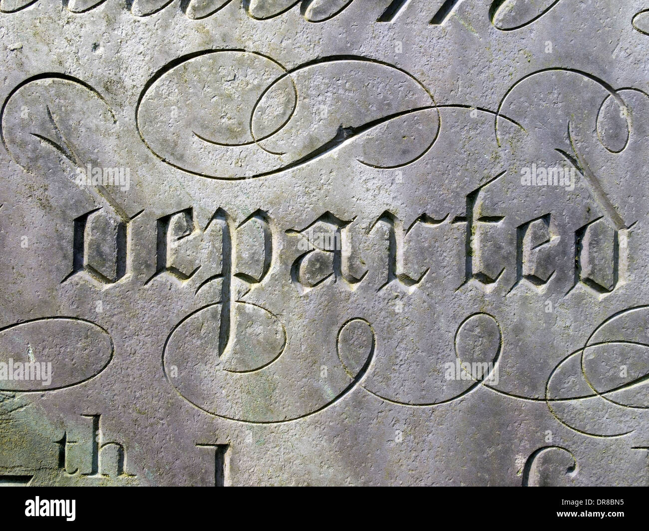 Close-up of ornate engraved cursive lettering on gravestone, St Mary's Churchyard, Melton Mowbray, Leicestershire, England, UK Stock Photo
