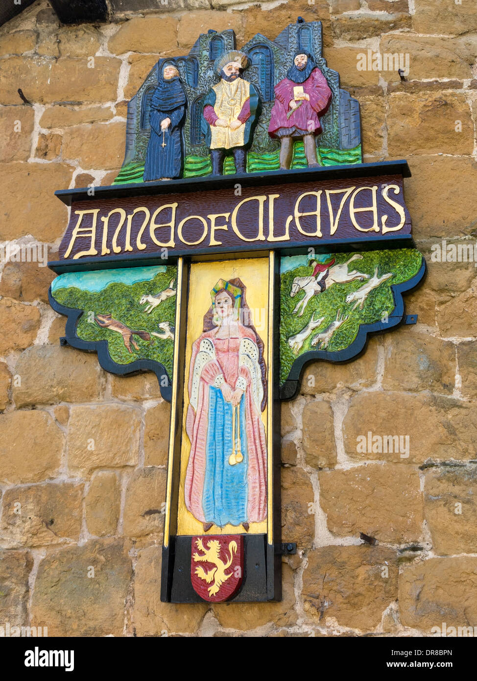 Old painted carved wooden sign for Anne of Cleves public house, Melton Mowbray, Leicestershire, England, UK Stock Photo