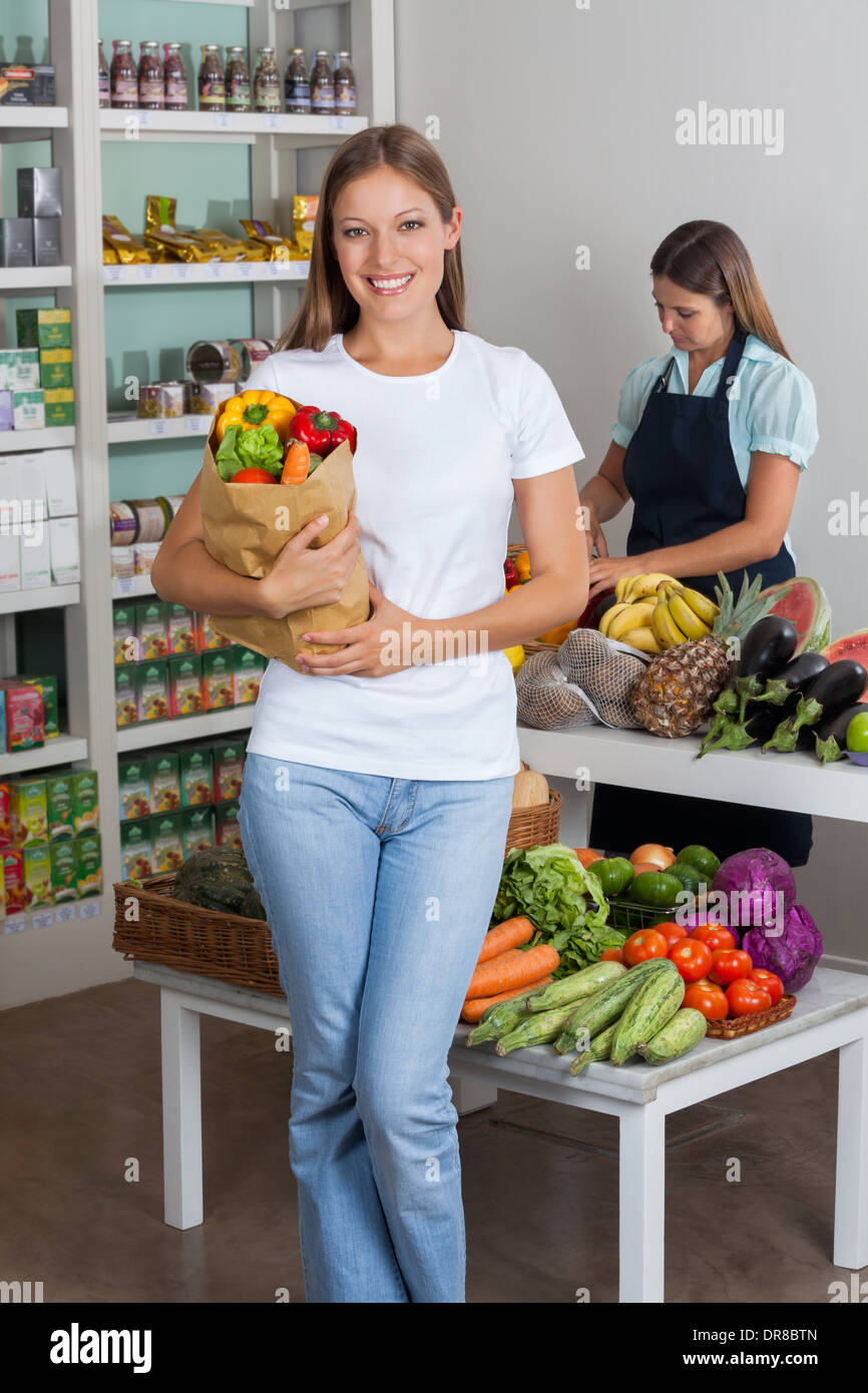 Woman Holding Grocery Bag At Grocery Store Stock Photo Alamy woman-holding-grocery-bag-at-grocery-store-stock-photo-alamy