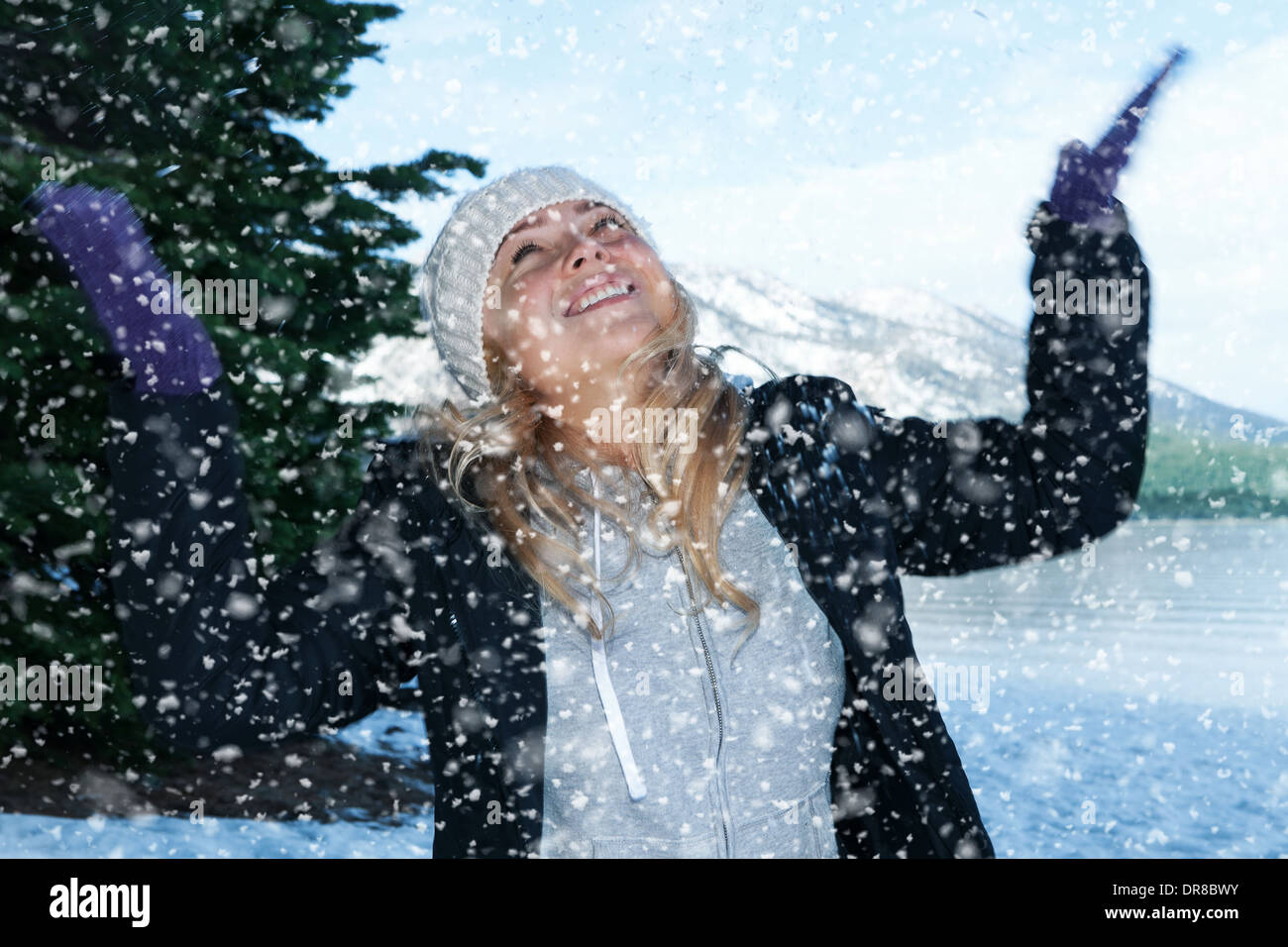 Portrait of young beautiful woman on winter outdoor background Stock Photo