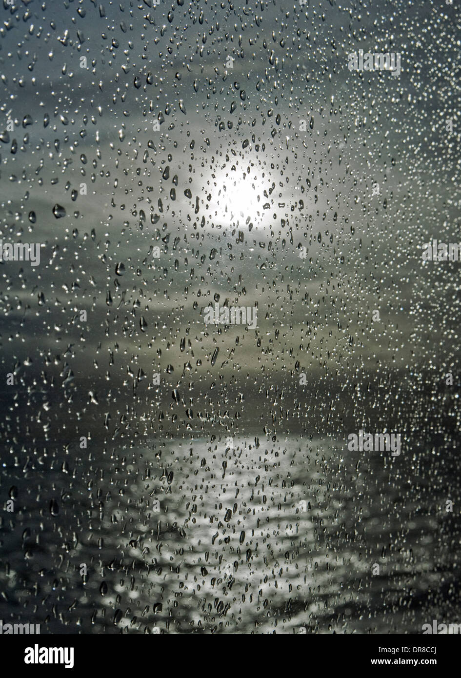 Storm over Belfast Lough, viewed through window of Whitehead to Belfast train. Stock Photo