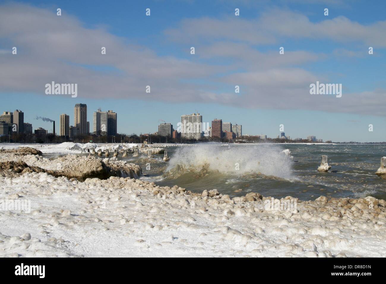 Chicago, USA. 21st January 2014.  Lake Michigan waves crash into ice formations at snowy North Avenue Beach after the latest lake effect snowstorm. The polar vortex has returned with frigid temperatures. Credit:  Todd Bannor/Alamy Live News Stock Photo