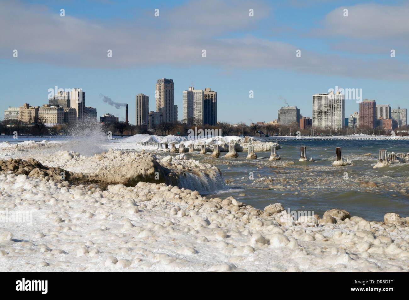 Chicago, USA. 21st January 2014.  Lake Michigan waves crash into ice formations at snowy North Avenue Beach after the latest lake effect snowstorm. The polar vortex has returned with frigid temperatures. Credit:  Todd Bannor/Alamy Live News Stock Photo