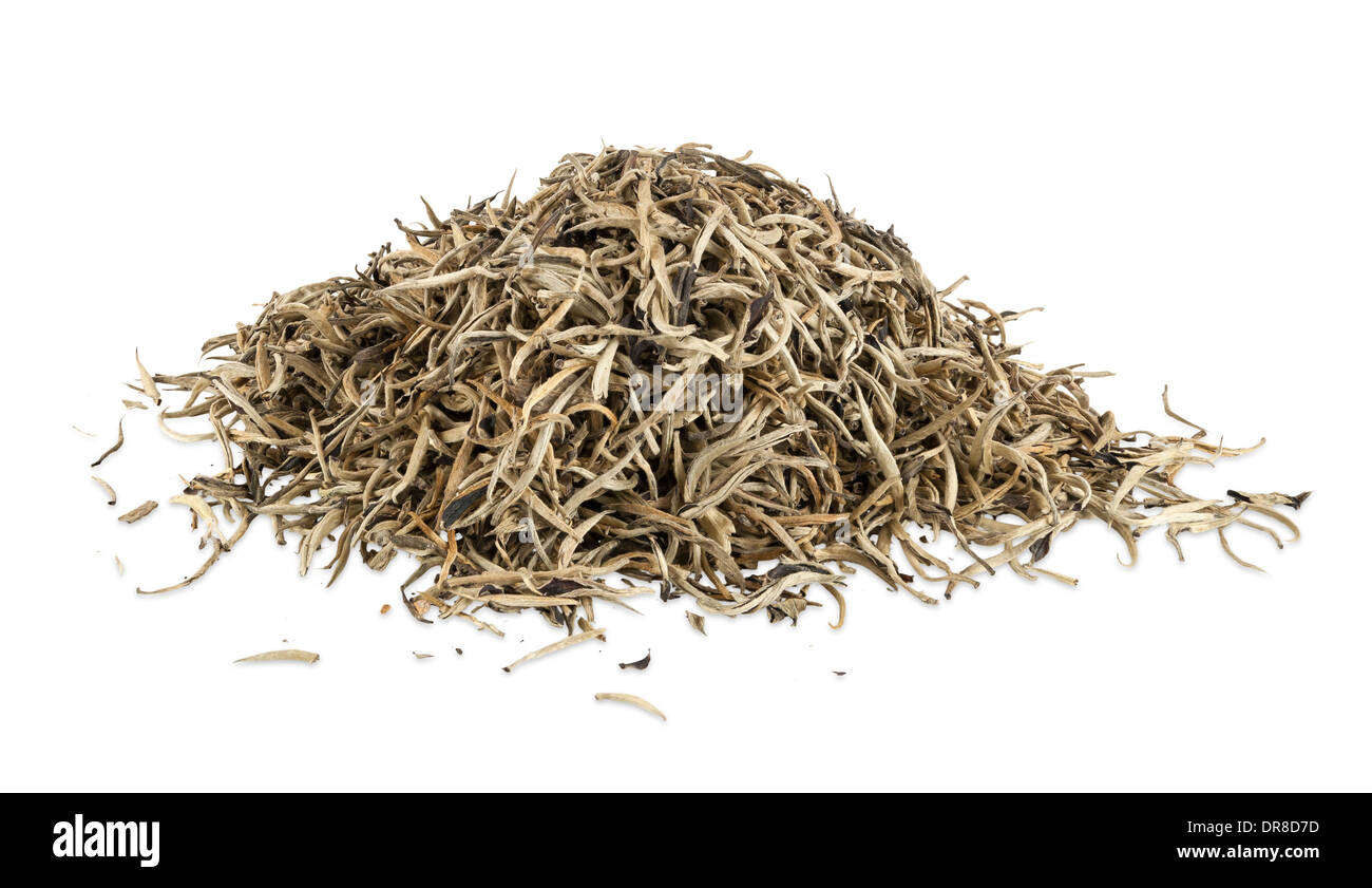 Heap of golden ceylon tea leaves isolated on white background with clipping path Stock Photo
