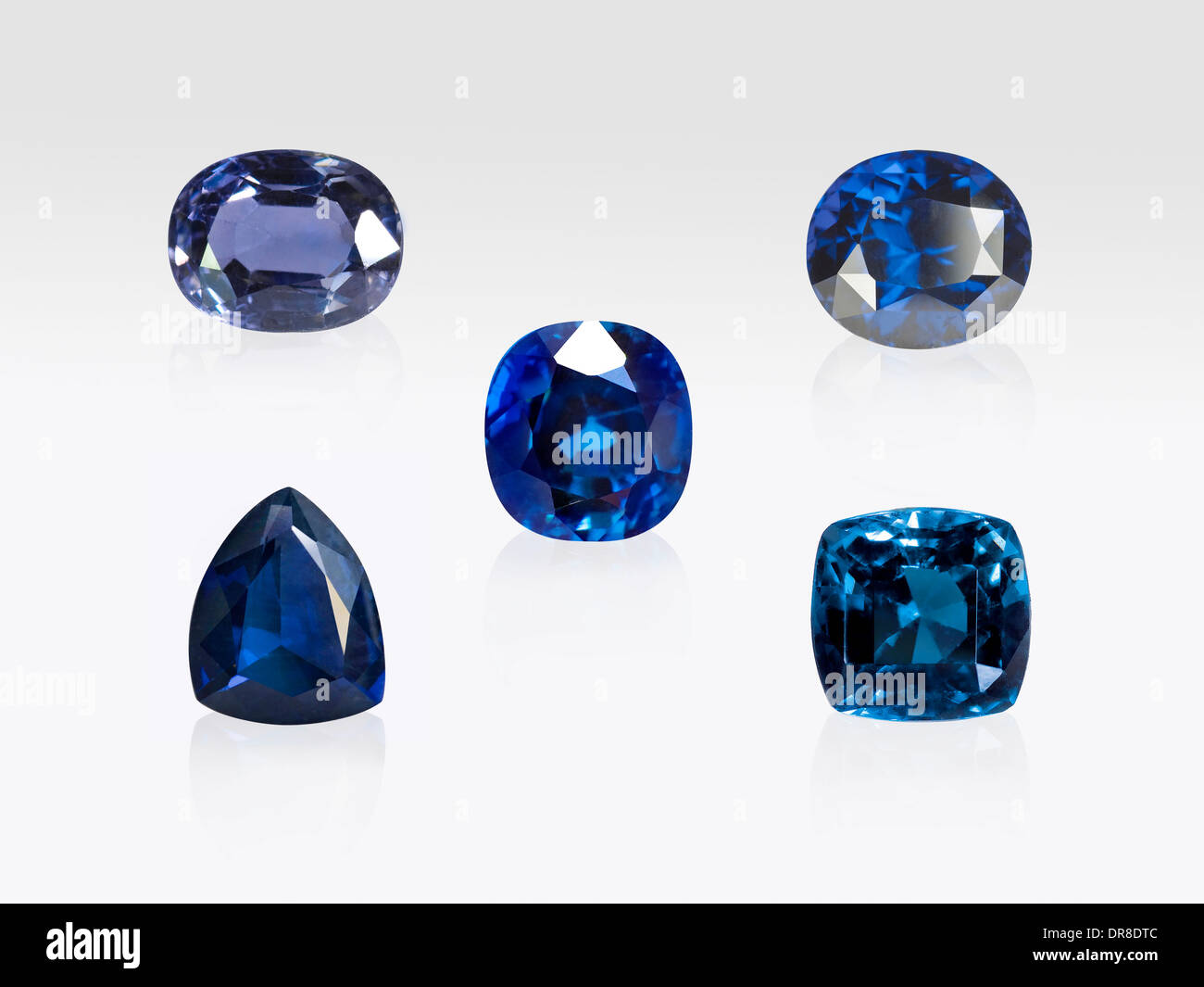 Blue Spinel gemstones on white background Stock Photo Alamy