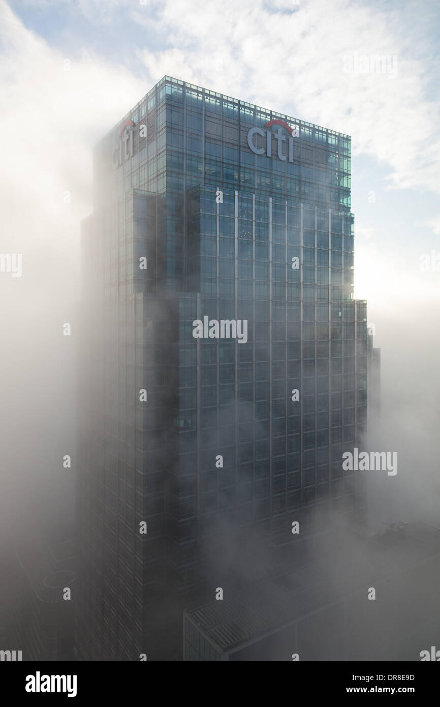 London UK, 21st Jan 2014. Fog swirls around the Citigroup Centre, 25 Canada Square in Canary Wharf. The building is 200m tall and was opened in 2001. It is currently the joint 4th tallest building in the UK. This was shot from 1 Canada Square, also in Canary Wharf. © Steve Bright/Alamy Live News Credit:  Steve Bright/Alamy Live News Stock Photo