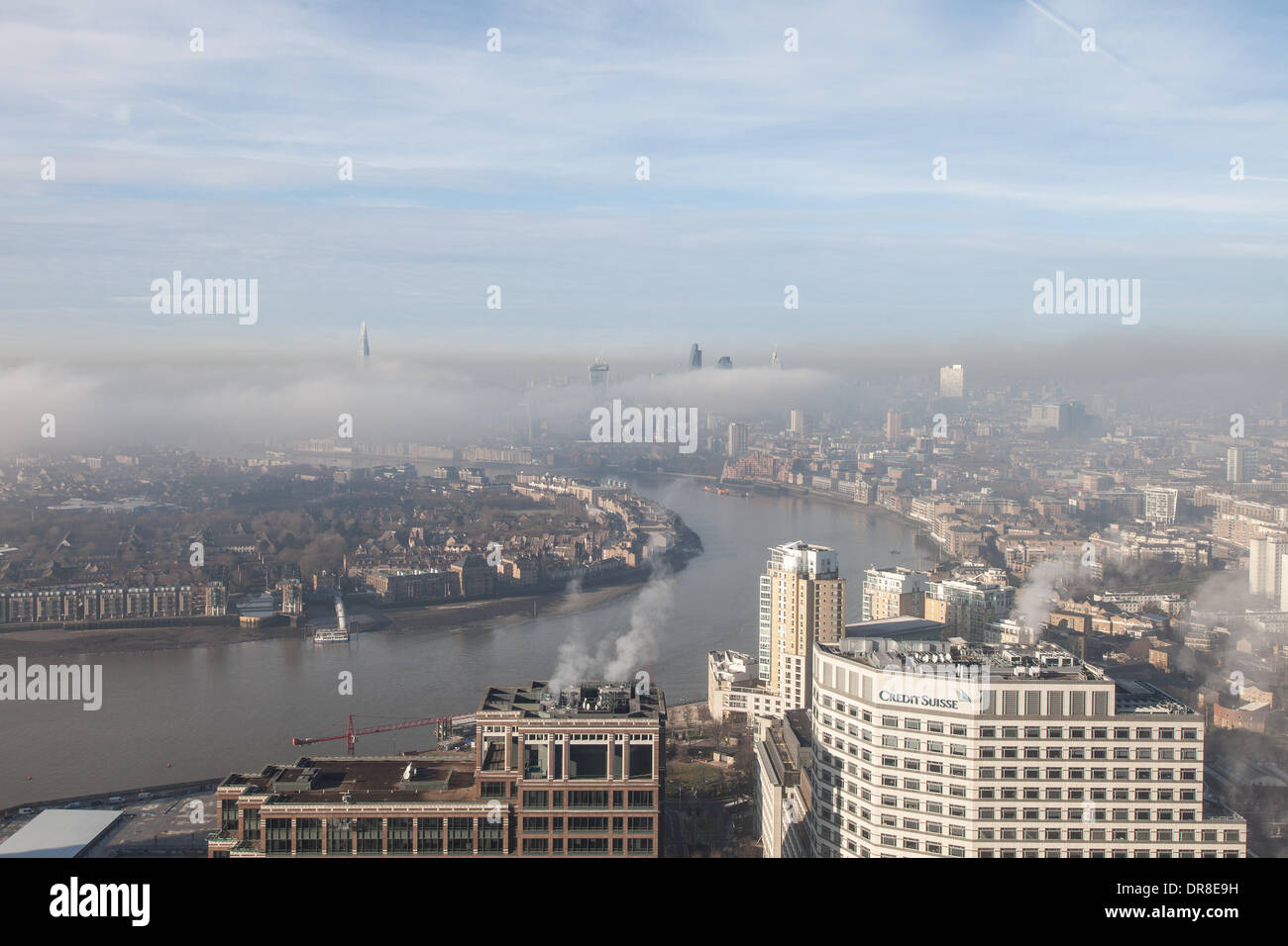 London UK, 21st Jan 2014. A bank of low fog shrouds the City of London and surrounding areas. The tops of London's tallest buildings are visible above the fog. This shot was taken from Canary Wharf. © Steve Bright/Alamy Live News Credit:  Steve Bright/Alamy Live News Stock Photo