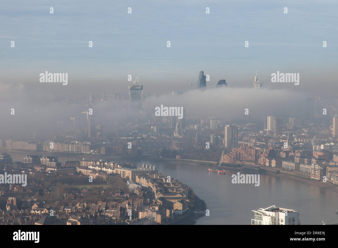 London UK, 21st Jan 2014. A bank of low fog shrouds the City of London and surrounding areas. The tops of some of London's tallest buildings are visible above the fog. This shot was taken from Canary Wharf. © Steve Bright/Alamy Live News Credit:  Steve Bright/Alamy Live News Stock Photo
