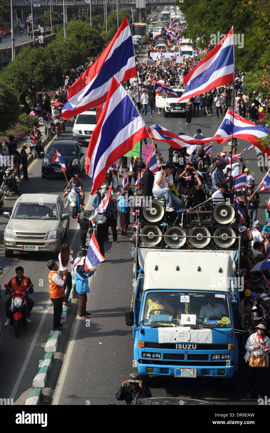 Bangkok, Thailand 21 January 2013.  Anti-goverment protesters wave Thai national flags during a march in downtown Bangkok. Thai government will impose a 60-day state of emergency in Bangkok and the surrounding provinces, start on 22 January, in an attempt to cope with the on-going political turmoil. Credit:  John Vincent/Alamy Live News Stock Photo