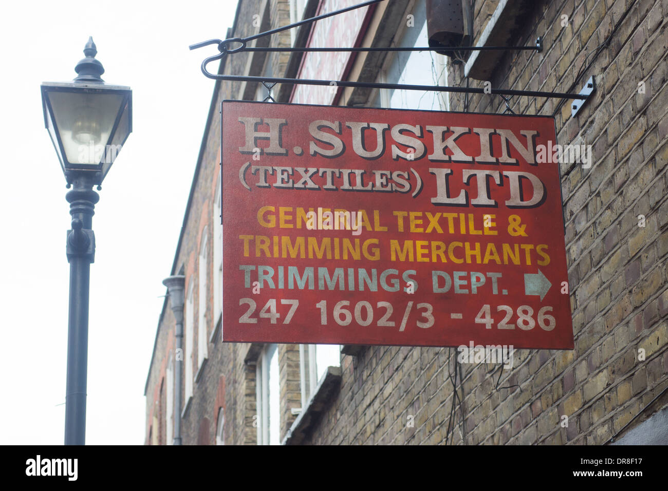 street sign Jewish textile shop Spitalfields.  Jewish London Stock Photo
