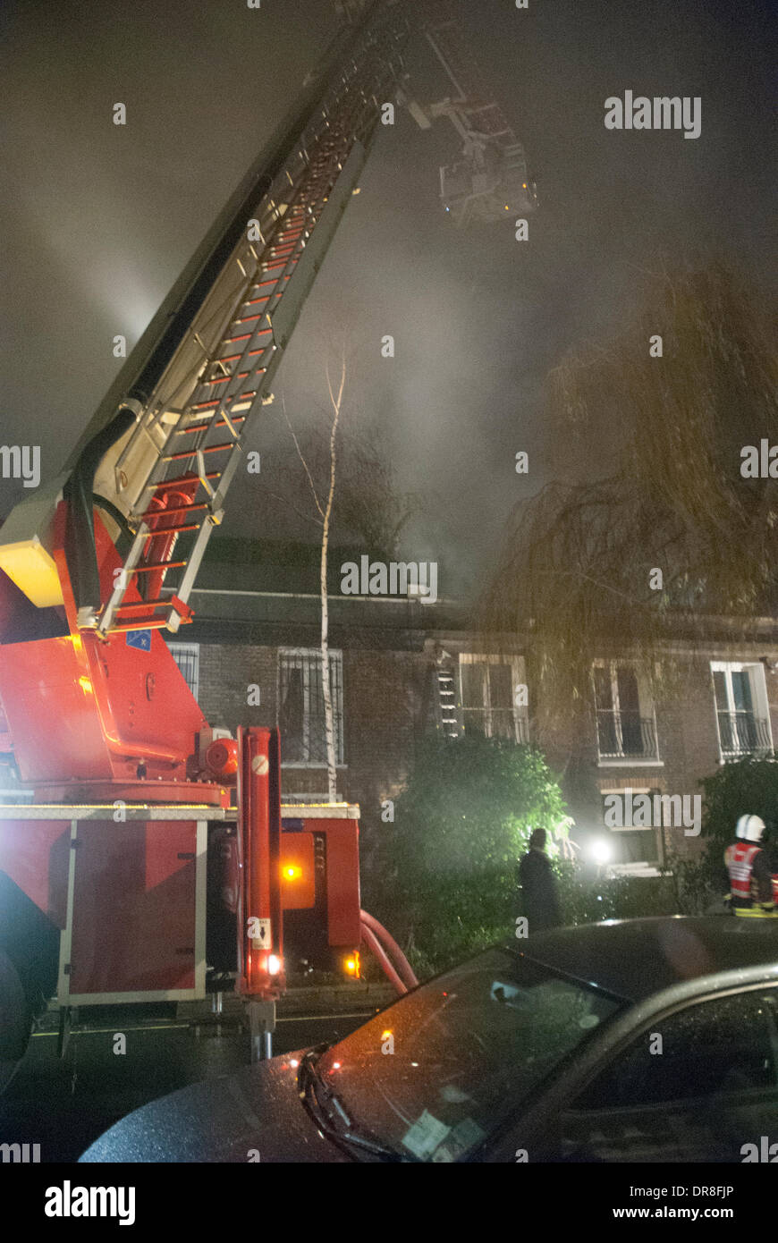 London, UK . 21st Jan, 2014. London Fire Service crew tackle a house