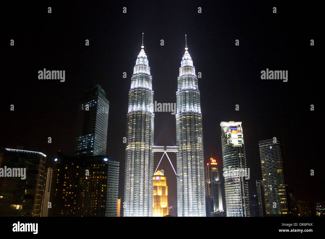 Illuminated Petronas Twin Towers at night Stock Photo