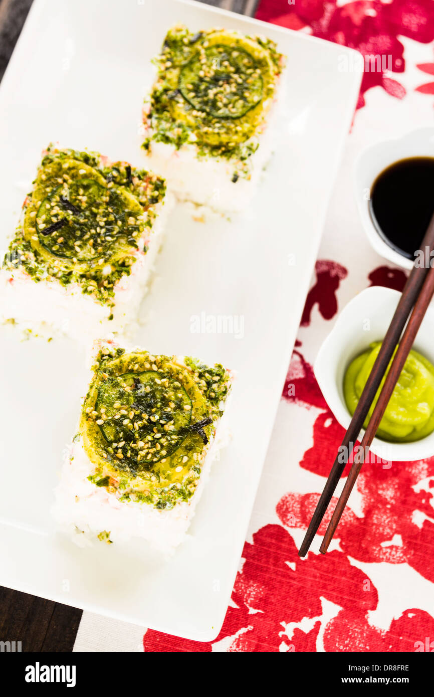 California pan sushi made of seasoned rice topped with sliced cucumber