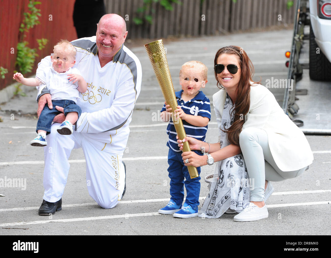 Danielle Lloyd  takes her children to a charity day at Camelot theme park, organised by the Liverpool Taxi drivers association.  Danielle was rescued at the roadside by the AA after her Range Rover broke down. She is also pictured with an Olympic torch bearer Liverpool, England - 20.06.12 Stock Photo