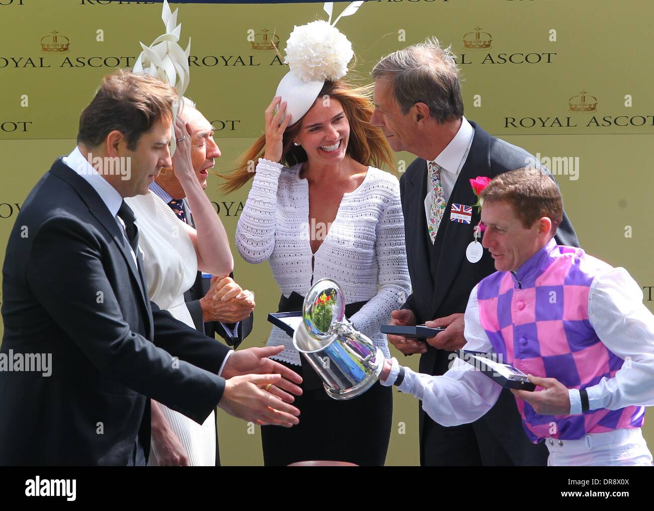 David Walliams and Lara Stone presenting the trophy for the The King Edward VII Stakes to jockey Thomas Chippendale, who knocked it off the podium, much to the amusement of Laura Stone, Henry Cecil Royal Ascot at Ascot Racecourse - Day 4  Berkshire, England - 22.06.12 Stock Photo