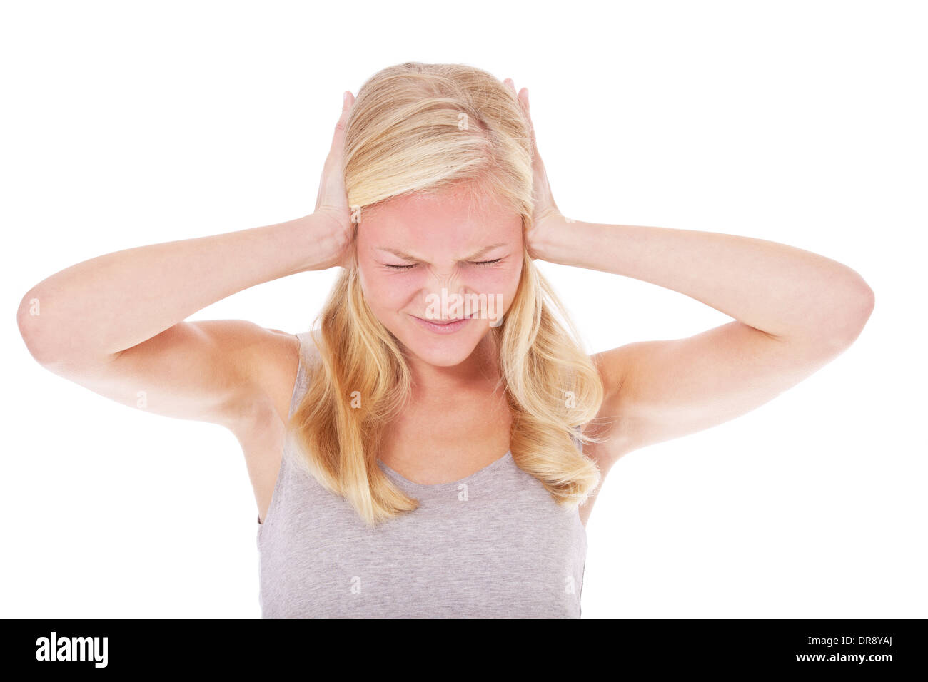 Young woman suffers from noise. All on white background. Stock Photo