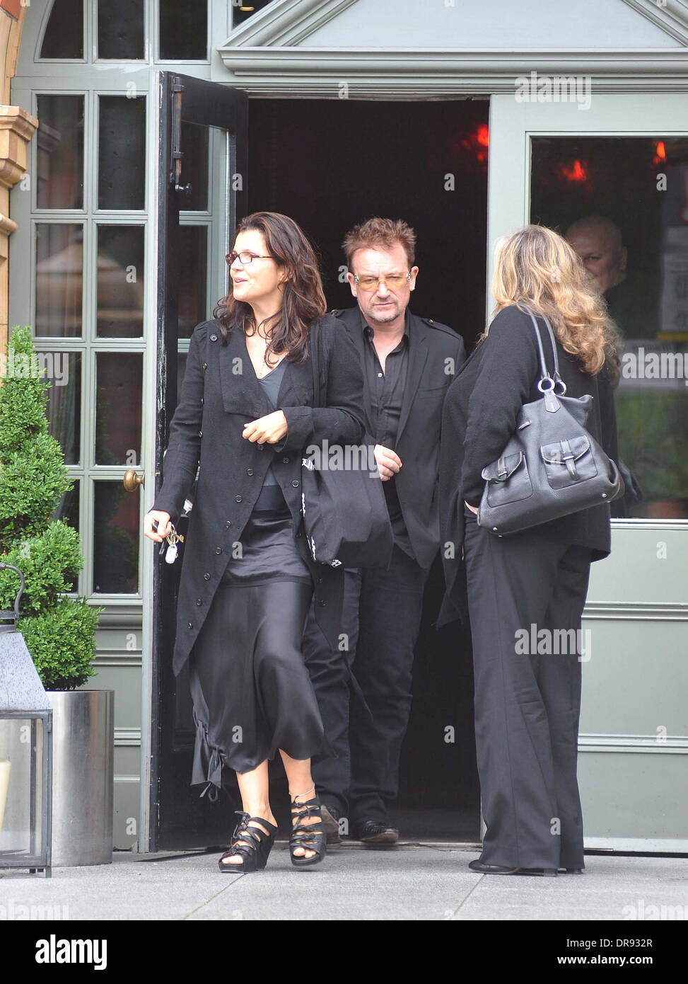 Ali Hewson and Bono U2 guitarist, The Edge meets Bono at the Dylan hotel amid reports that his mother Gwenda Evans has died Dublin, Ireland - 13.06.12 Stock Photo