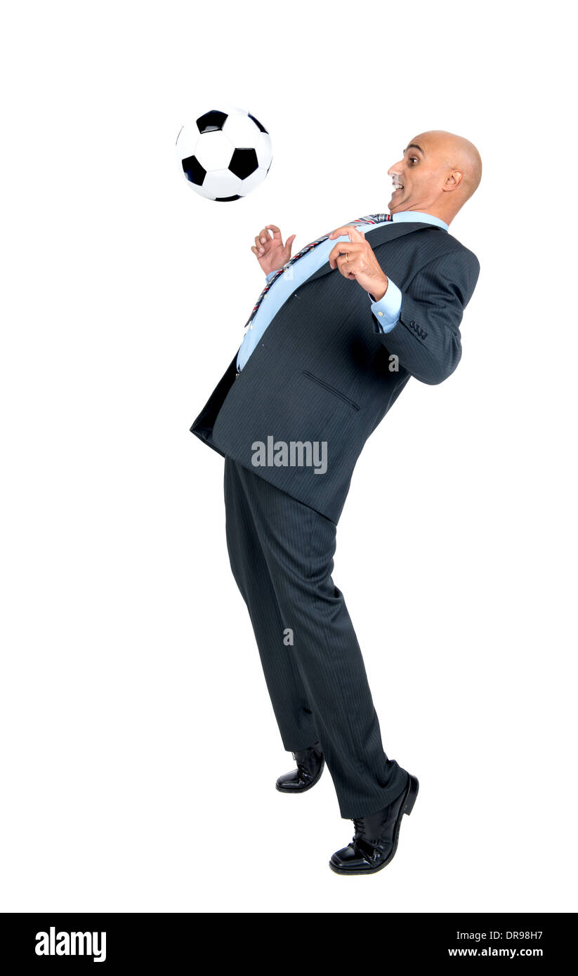 Businessman playing soccer ball isolated in white Stock Photo - Alamy