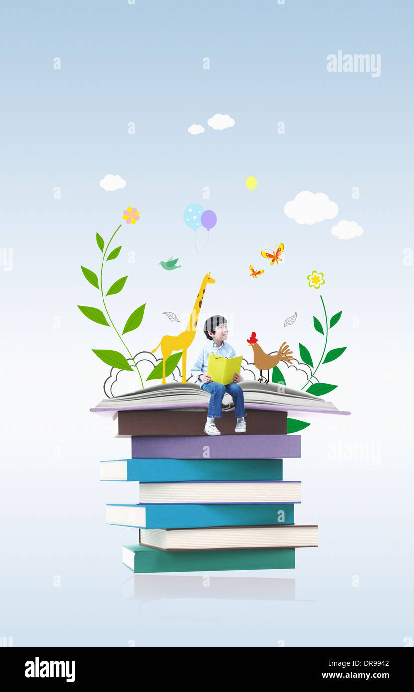 Boy sitting pile of books hi-res stock photography and images - Alamy