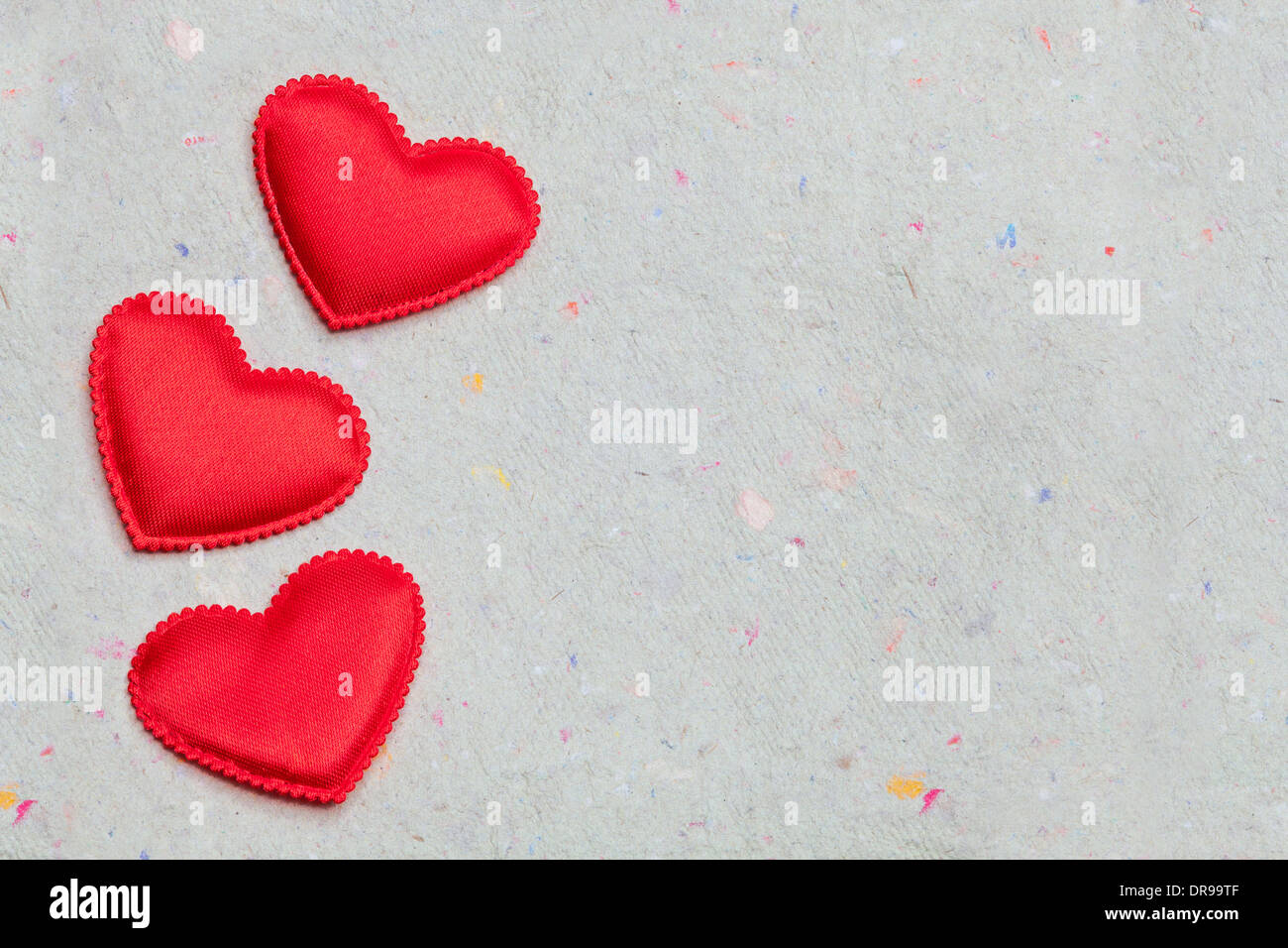 red hearts on vintage paper background with copyspace Stock Photo - Alamy