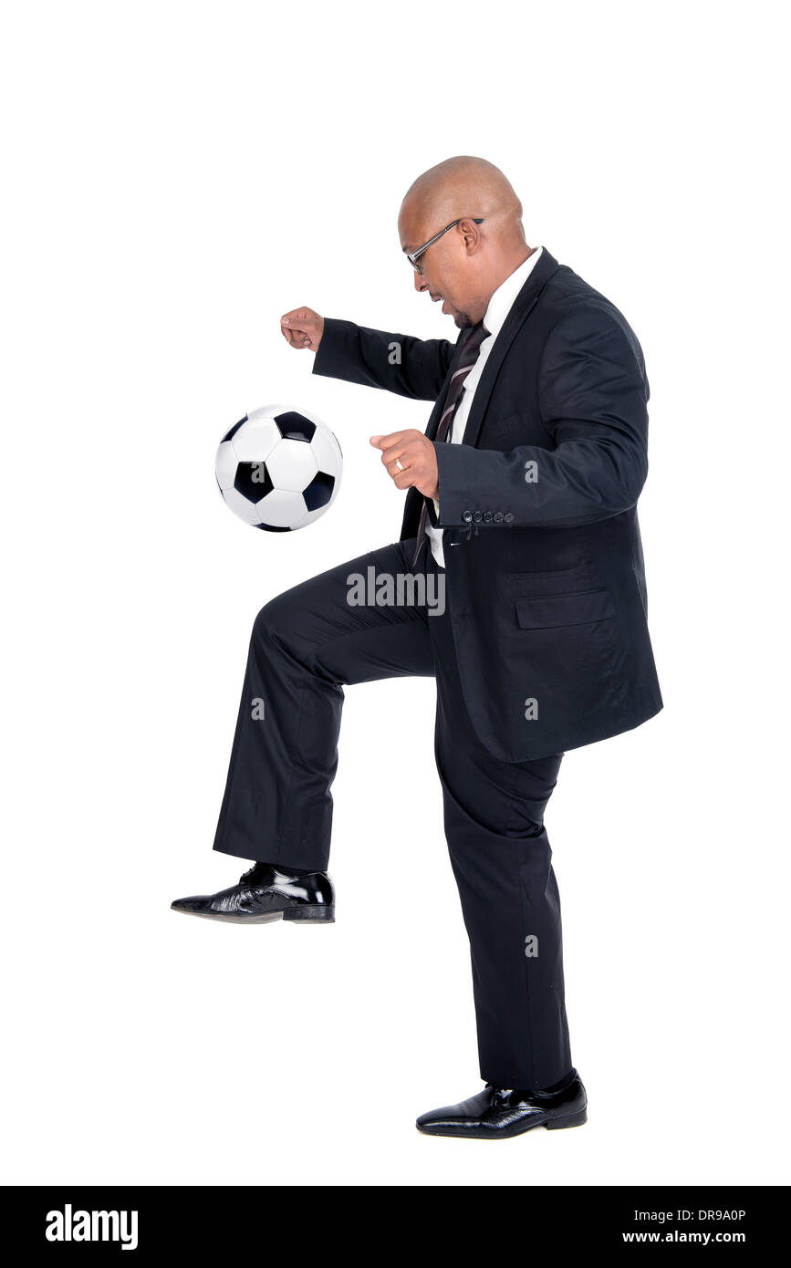 Businessman playing soccer ball isolated in white Stock Photo - Alamy