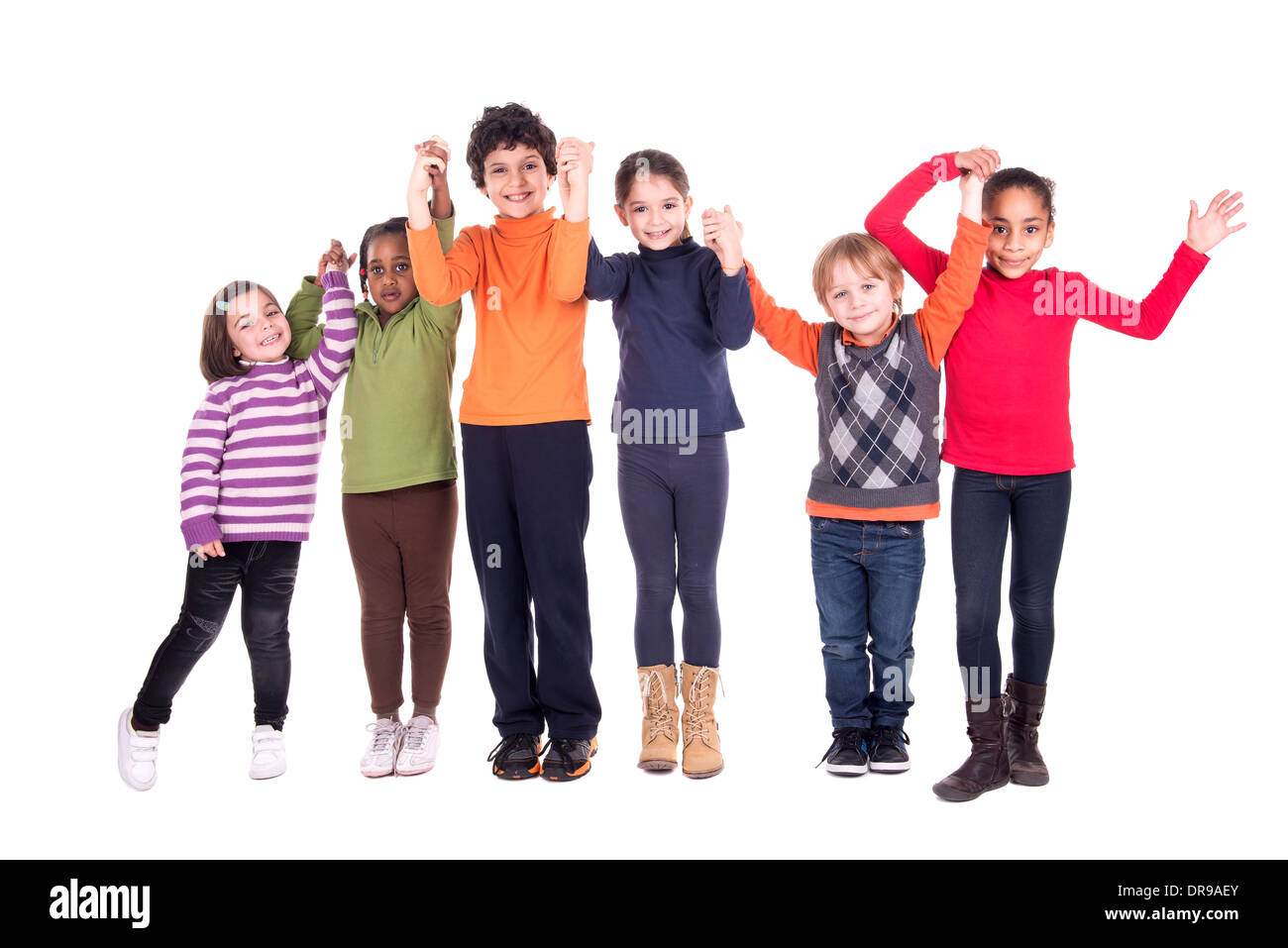 Group of children posing with hands up isolated in white Stock Photo