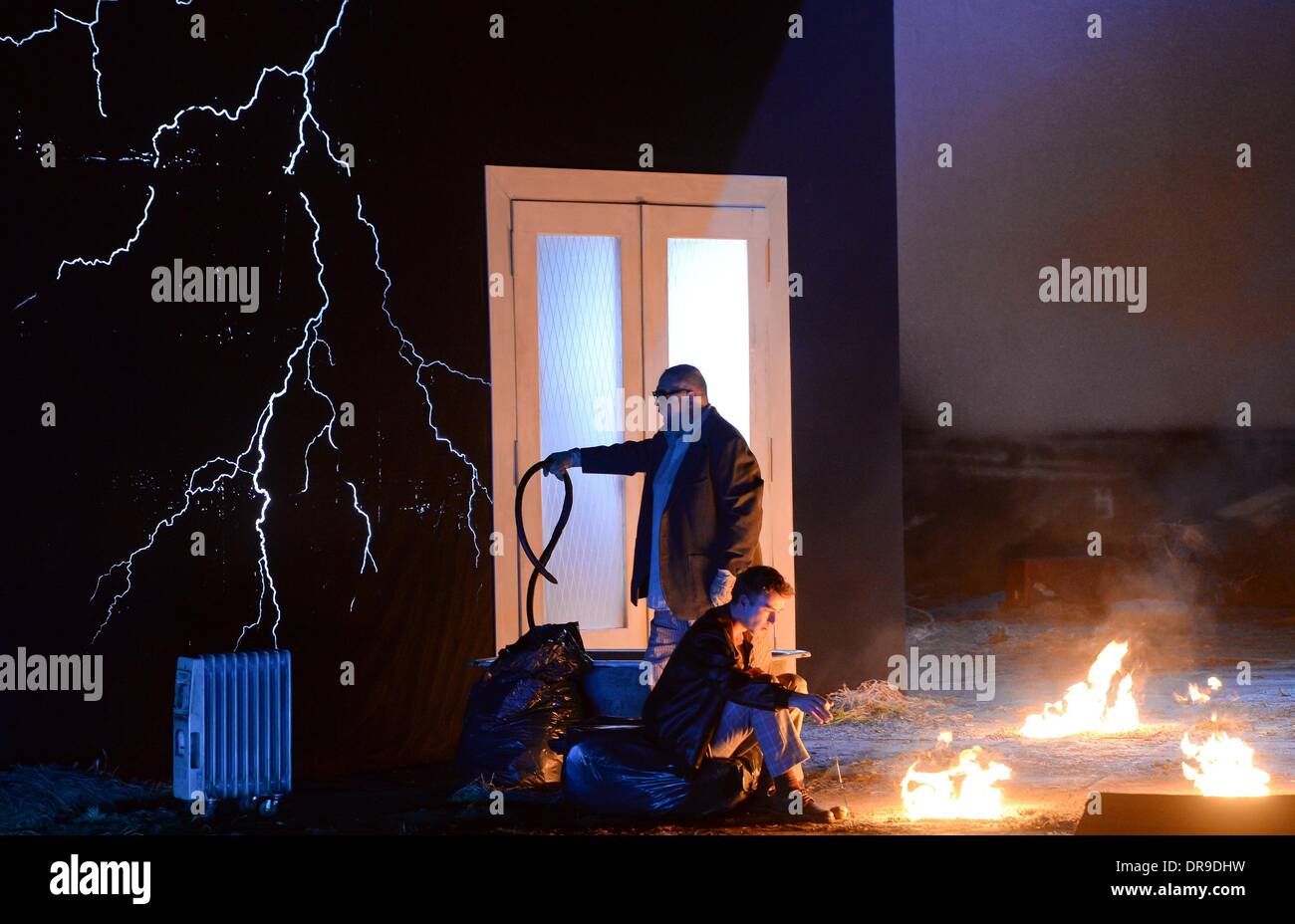 Berlin, Germany. 20th Jan, 2014. German tenor Florian Hoffmann (Kudrjasch, sitting) and British bass-baritone Pavlo Hunka (Dikoj) perform during the rehearsal for the opera "Kat'a Kabanova" at the State Opera in the Schillertheater in Berlin, Germany, 20 January 2014. The opera by Leos Janacek and directed by Simon Rattle will premiere on 25 January 2014. Photo: SOEREN STACHE/dpa/Alamy Live News Stock Photo