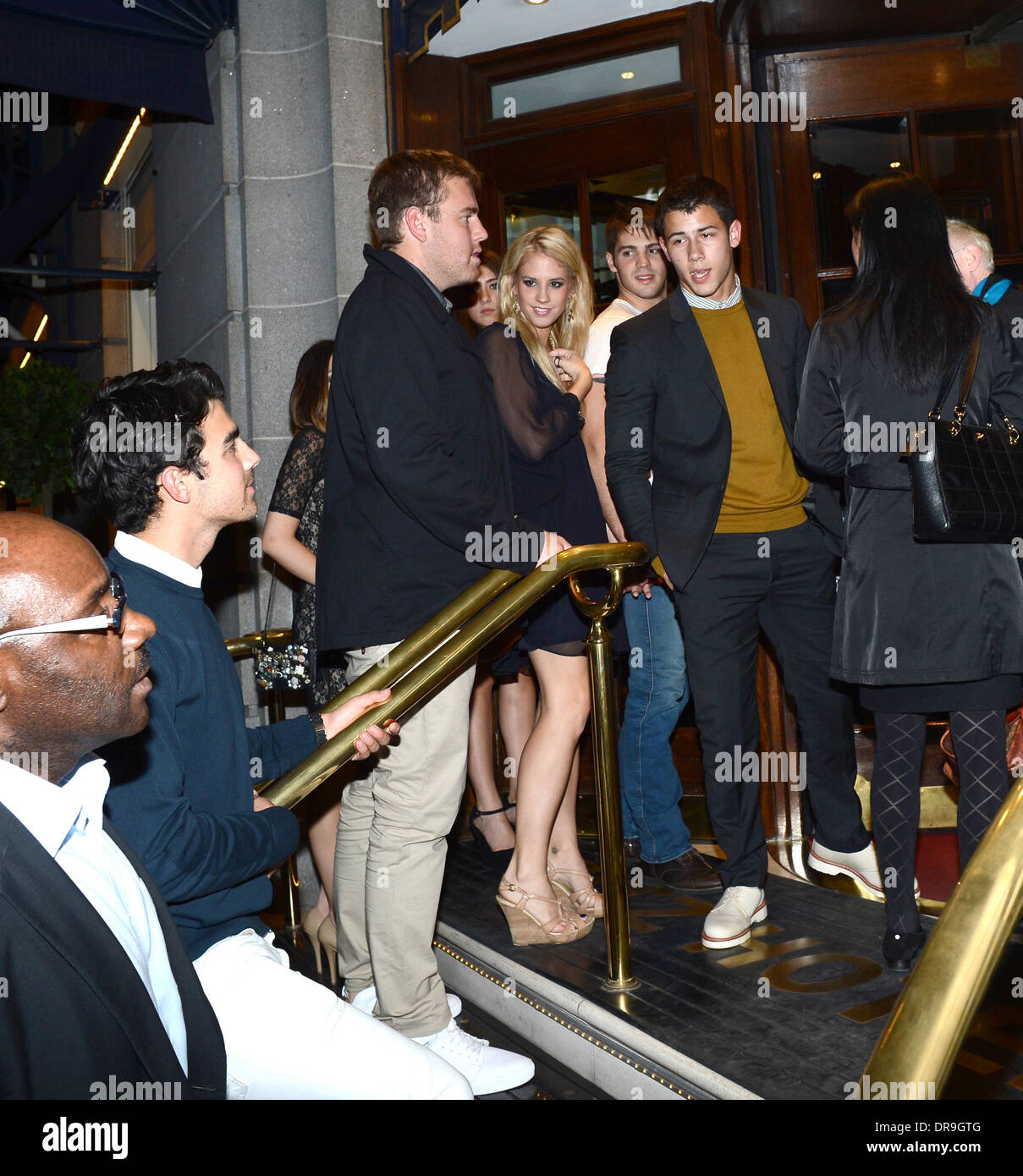 Kevin and Joe Jonas arrive back at the Ritz Hotel with friends only to find  that they had been locked out. They had to wait for 15 minutes before  security would let