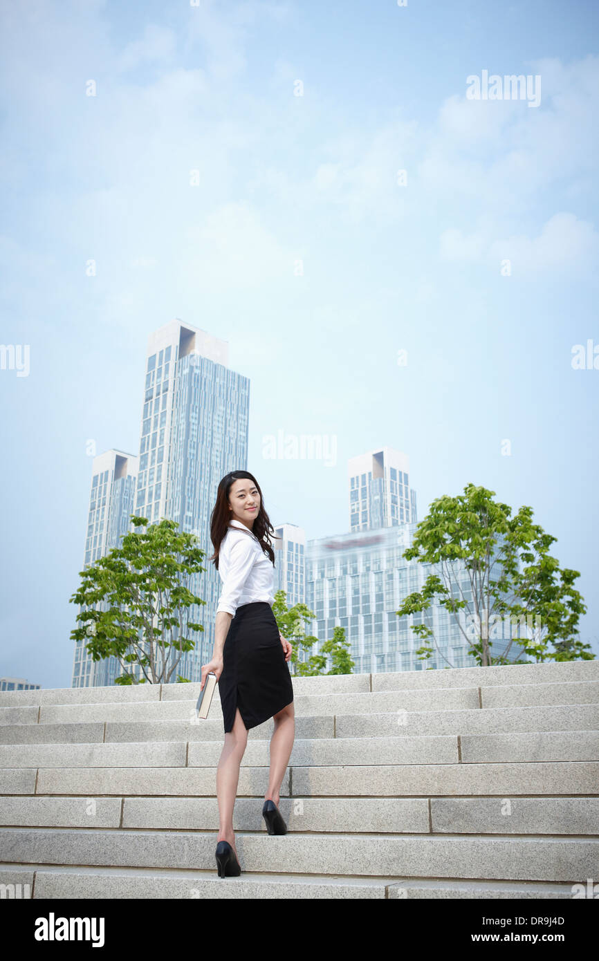 a business woman walking up stairs Stock Photo - Alamy