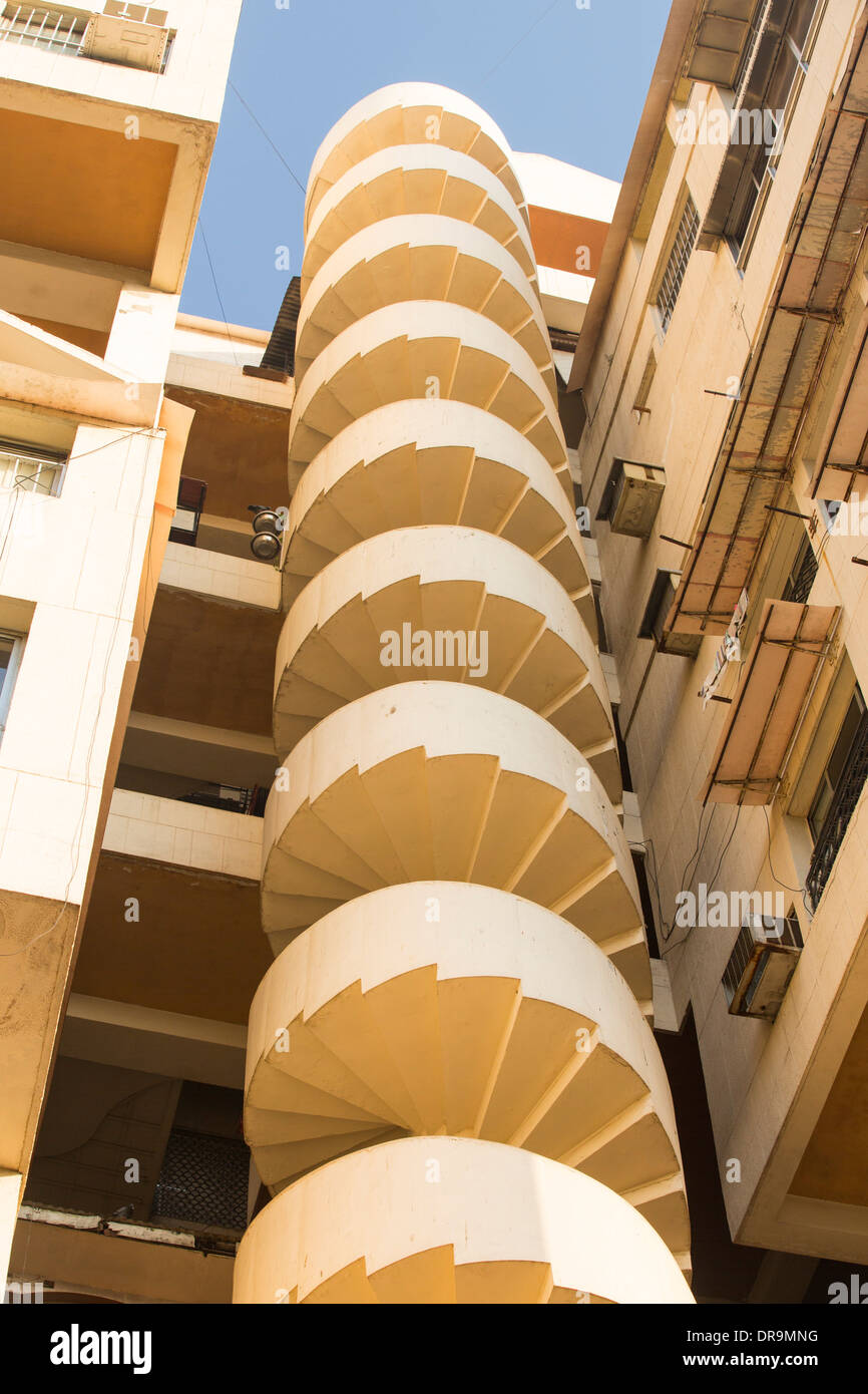 An apartment block with a spiral staircase fire escape in Ahmedabad
