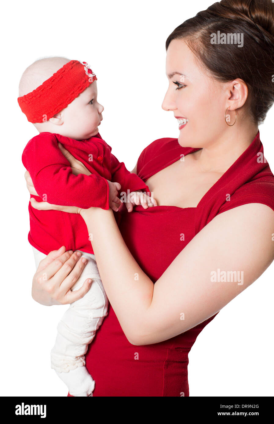 Happy mom and child girl hugging and laughing on isolated white background Stock Photo