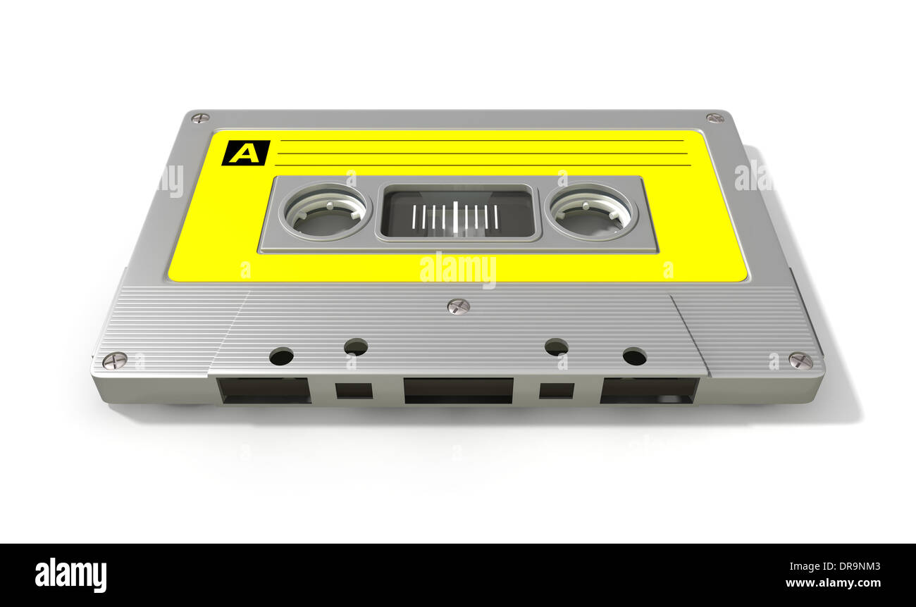 A close up view of a grey vintage audio cassette tape with a yellow label on an isolated white background Stock Photo