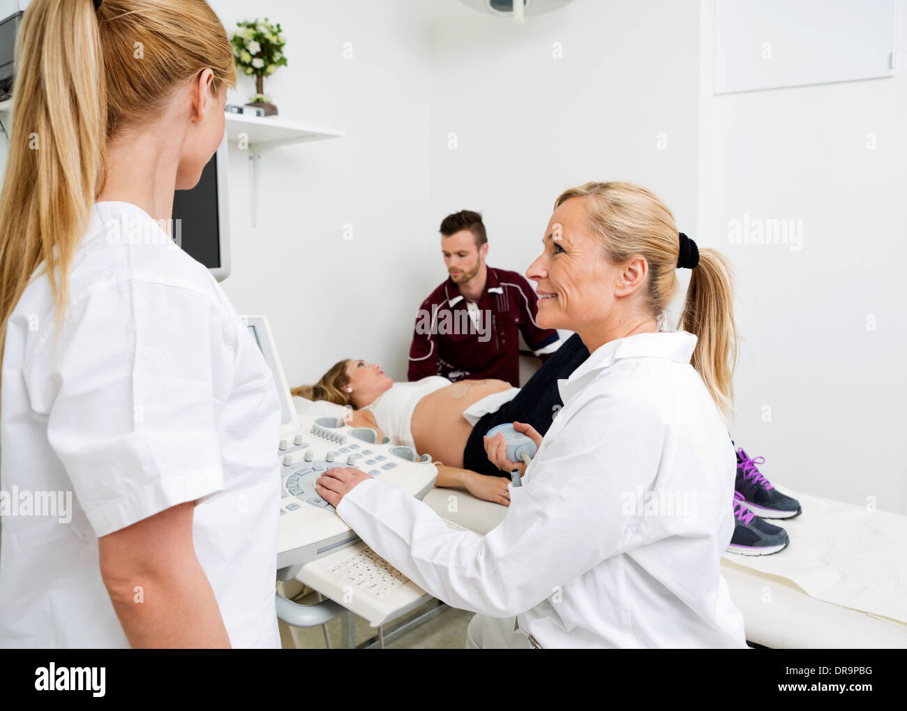 Female Doctors Communicating By Ultrasound Machine Stock Photo Alamy