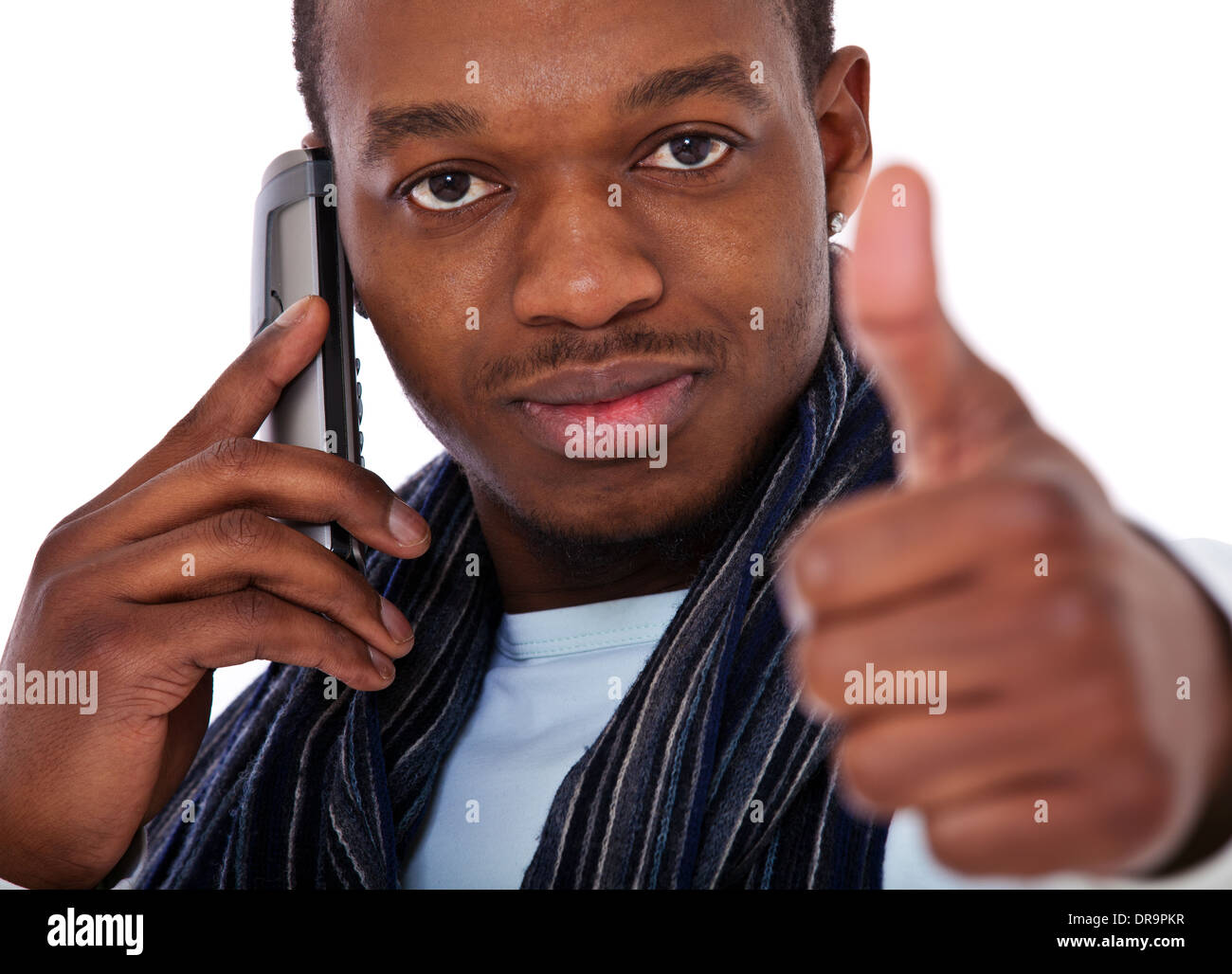 Black guy taking a phone call and shows thumbs up. Stock Photo