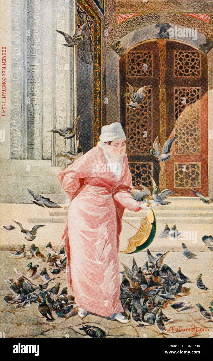 Lady feeding the pigeons - Constantinople, Turkey Stock Photo