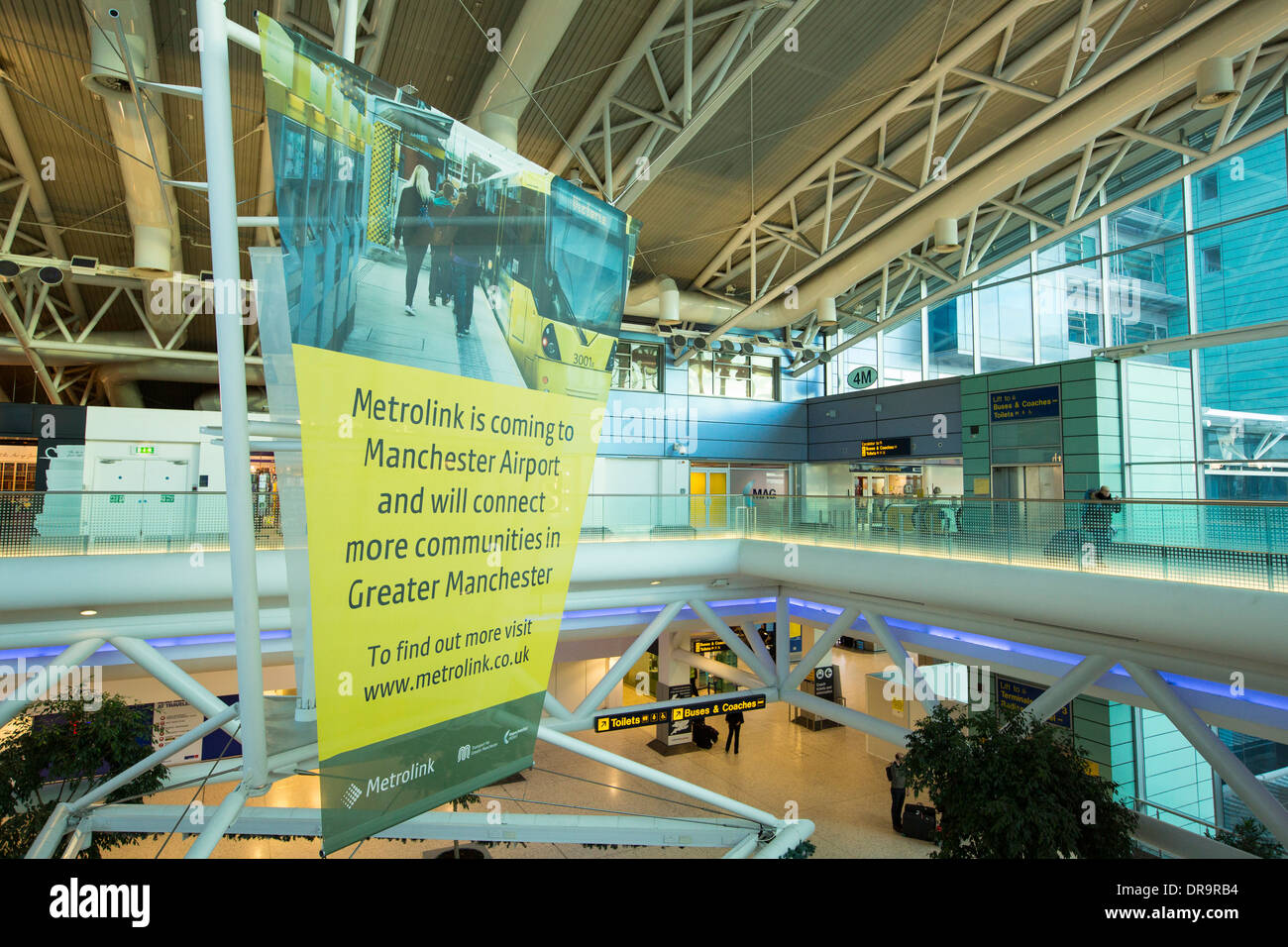 An advert for the extension of the Metrolink tram system at Manchester Airport train station, UK. Stock Photo
