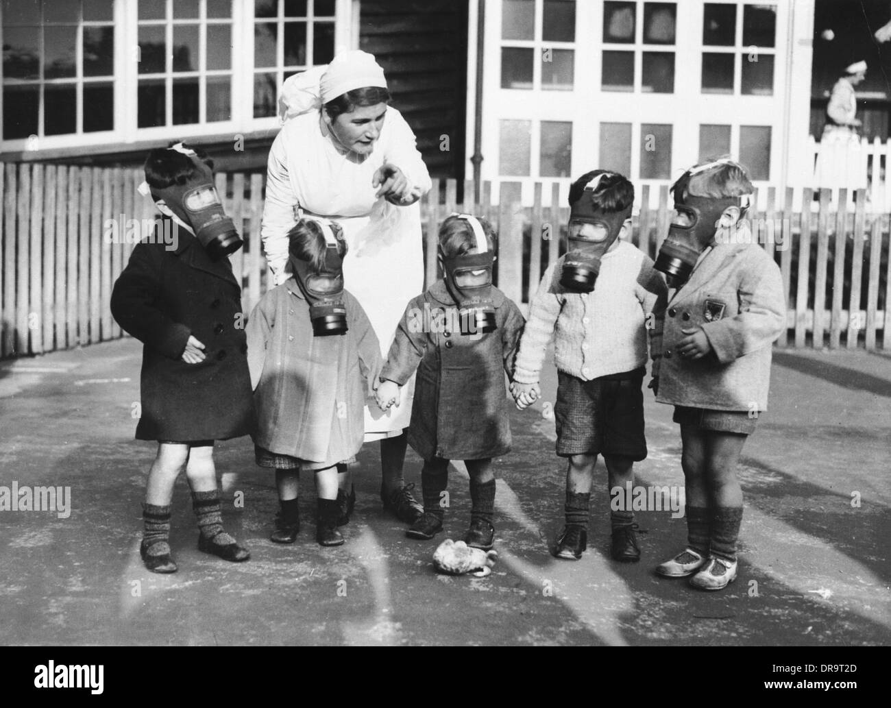 Children in gas masks Stock Photo