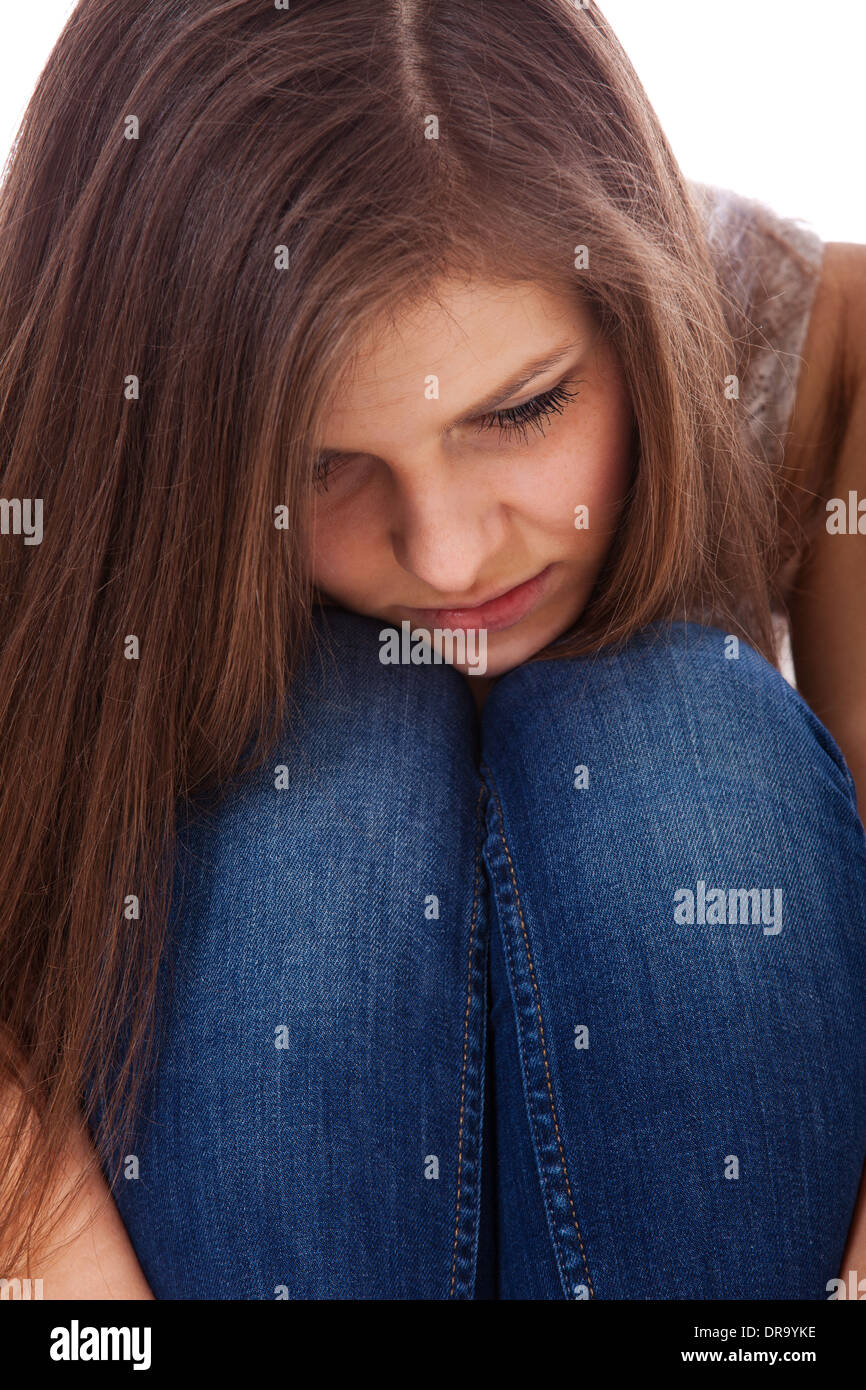 Teenage girl in bad mood. All on white background. Stock Photo