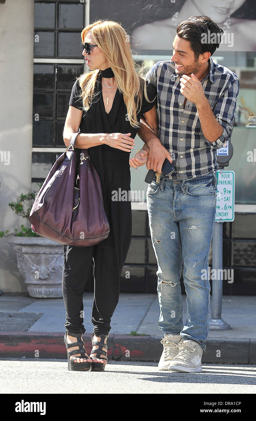 Rachel Zoe and her assistant walking arm in arm in Beverly Hills