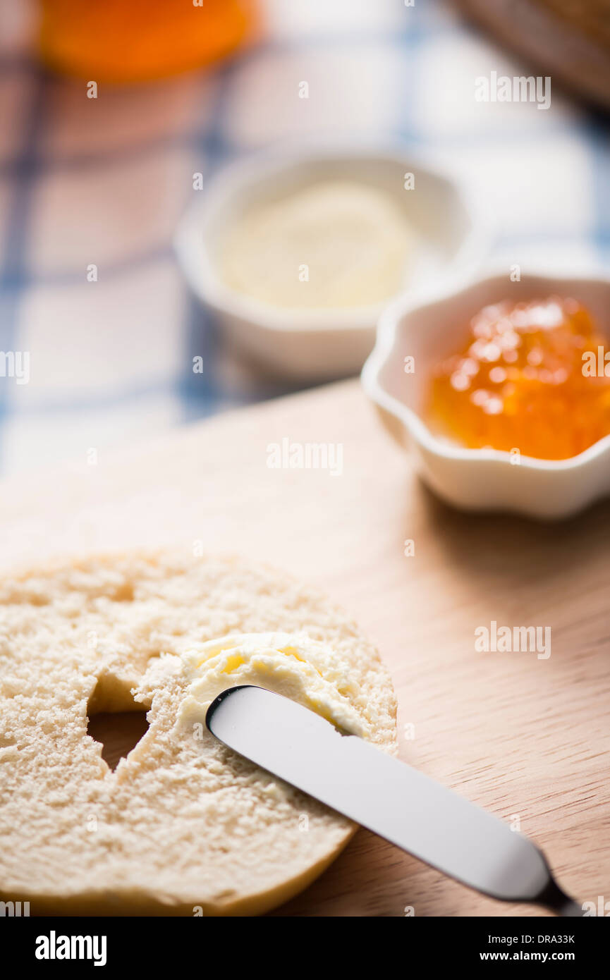 cream cheese spread on top of a bagel Stock Photo Alamy