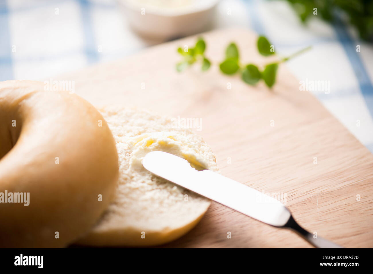 cream cheese spread on top of a bagel Stock Photo Alamy