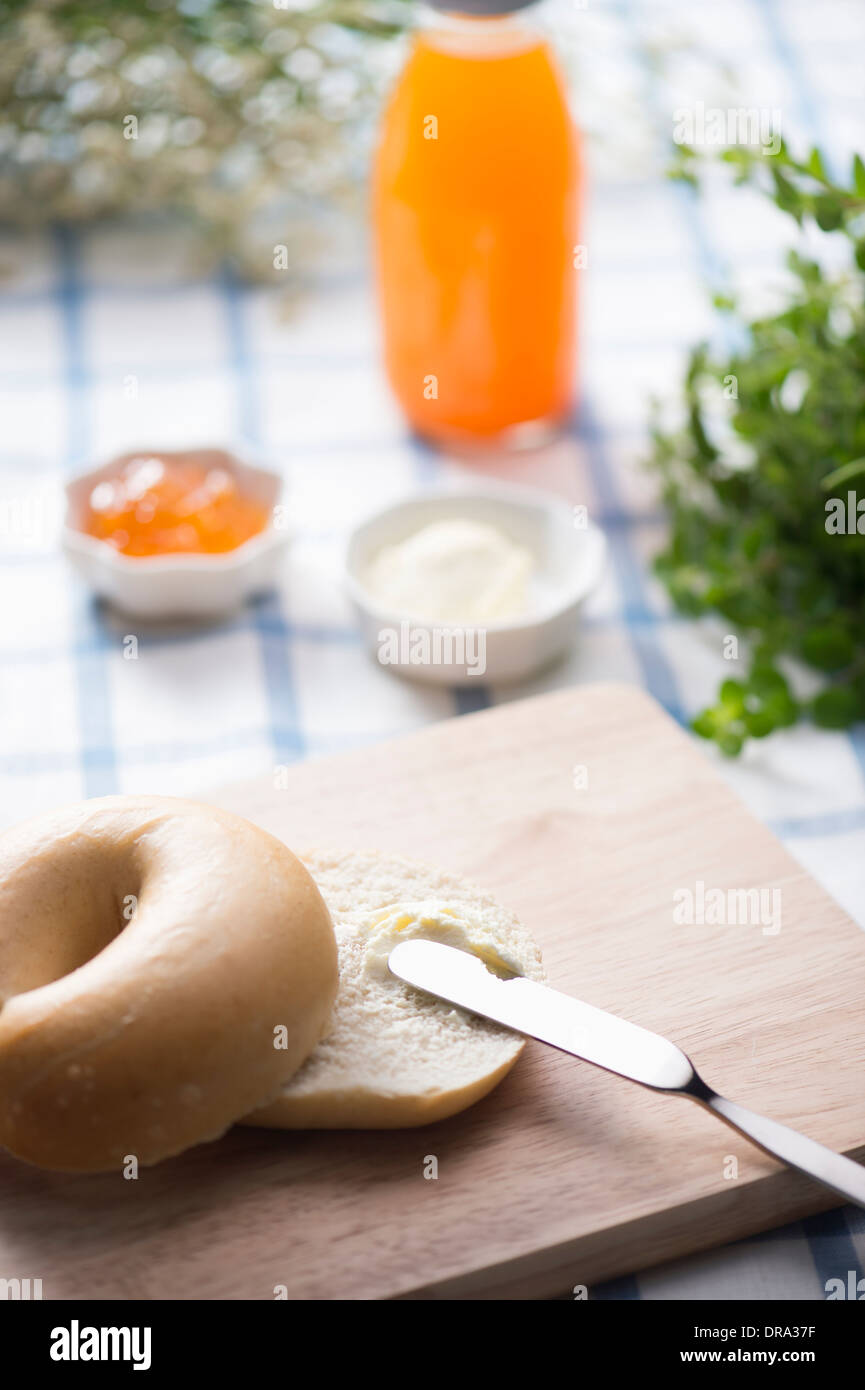 cream cheese spread on top of a bagel Stock Photo Alamy