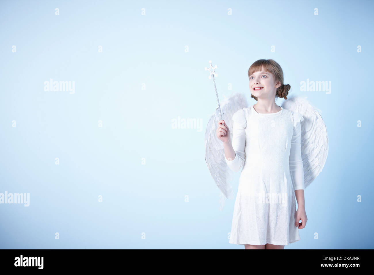 a girl dressed as an angel Stock Photo - Alamy