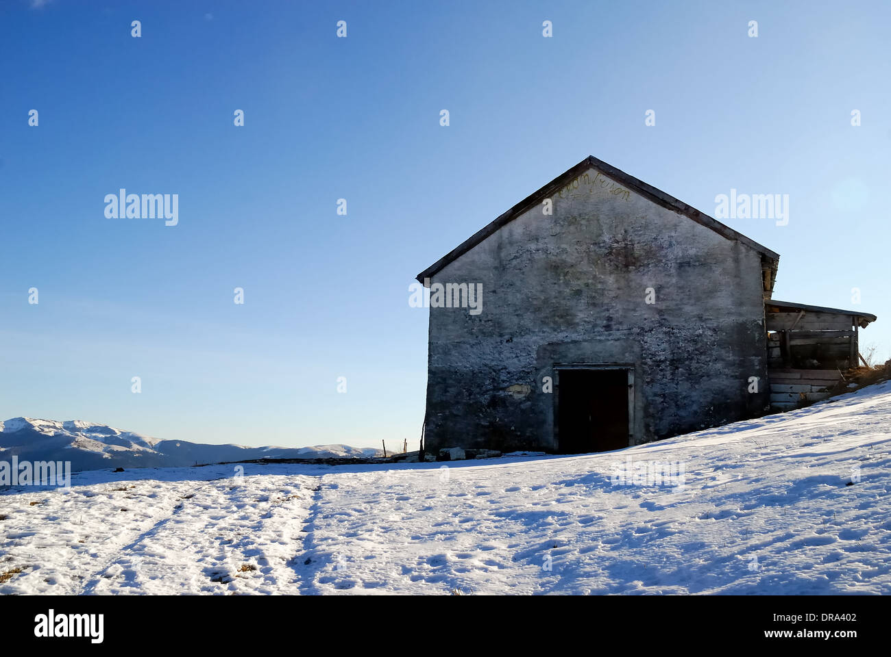 Enego, Venetian Pre-Alps, Italy. A mountain hut in the snow. Stock Photo
