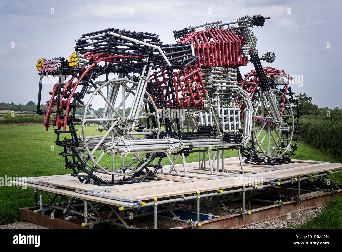 Motorcycle constructed from metal tubes on display in a field in UK Stock Photo